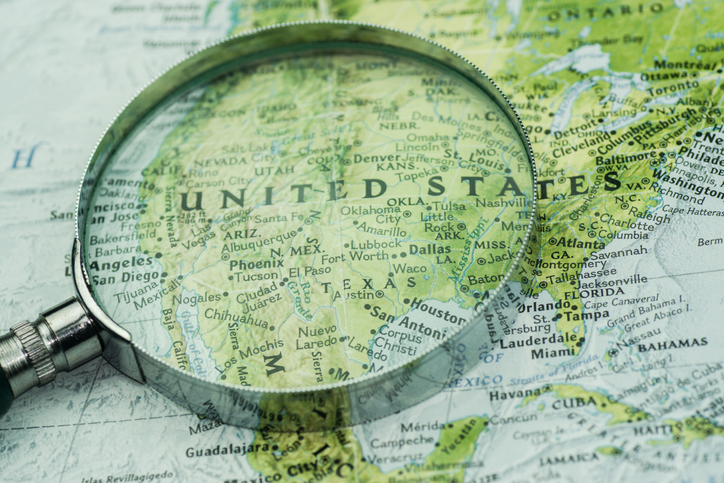 A shot of magnifier glass over map of U.S.