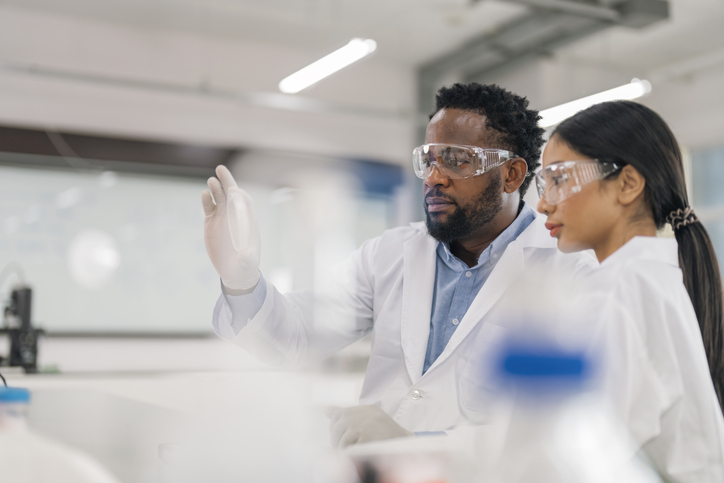 Photo shows scientists working together in laboratory