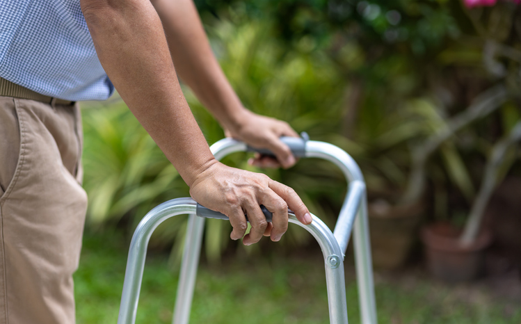 Photo shows Older man exercise walking.